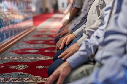 Men praying inside the mosque